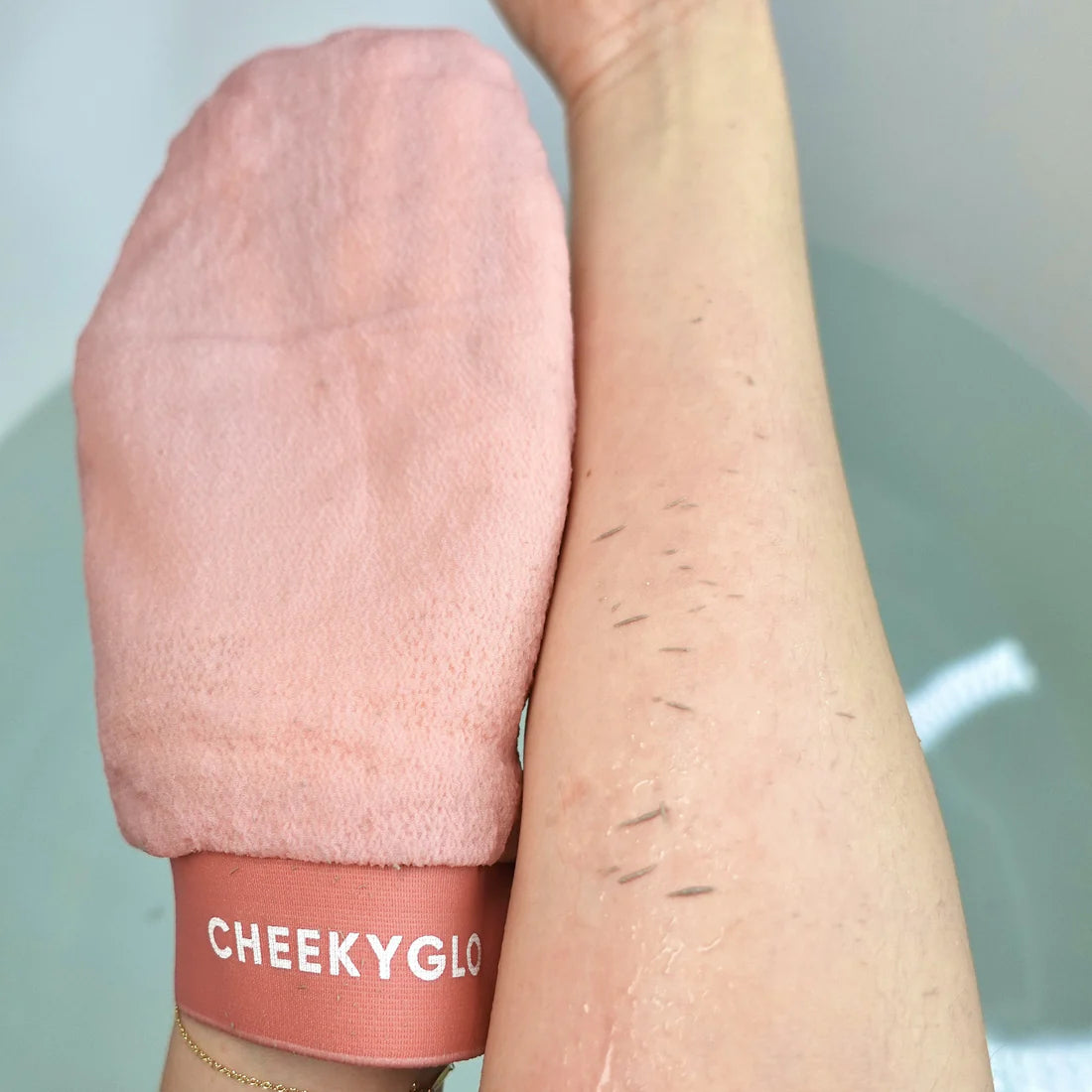 visible dead skin on skin after using the cheekyglo exfoliating glove