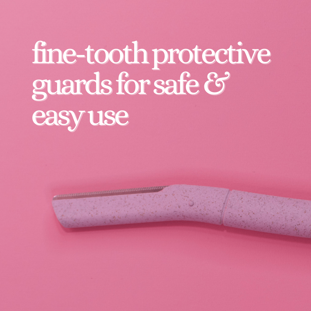 A close-up of the CheekyGlo Dermablades, a pink grooming tool with fine-tooth protective guards, set against a vibrant pink background. Text above reads, "eco-friendly blades for safe & easy facial hair removal.