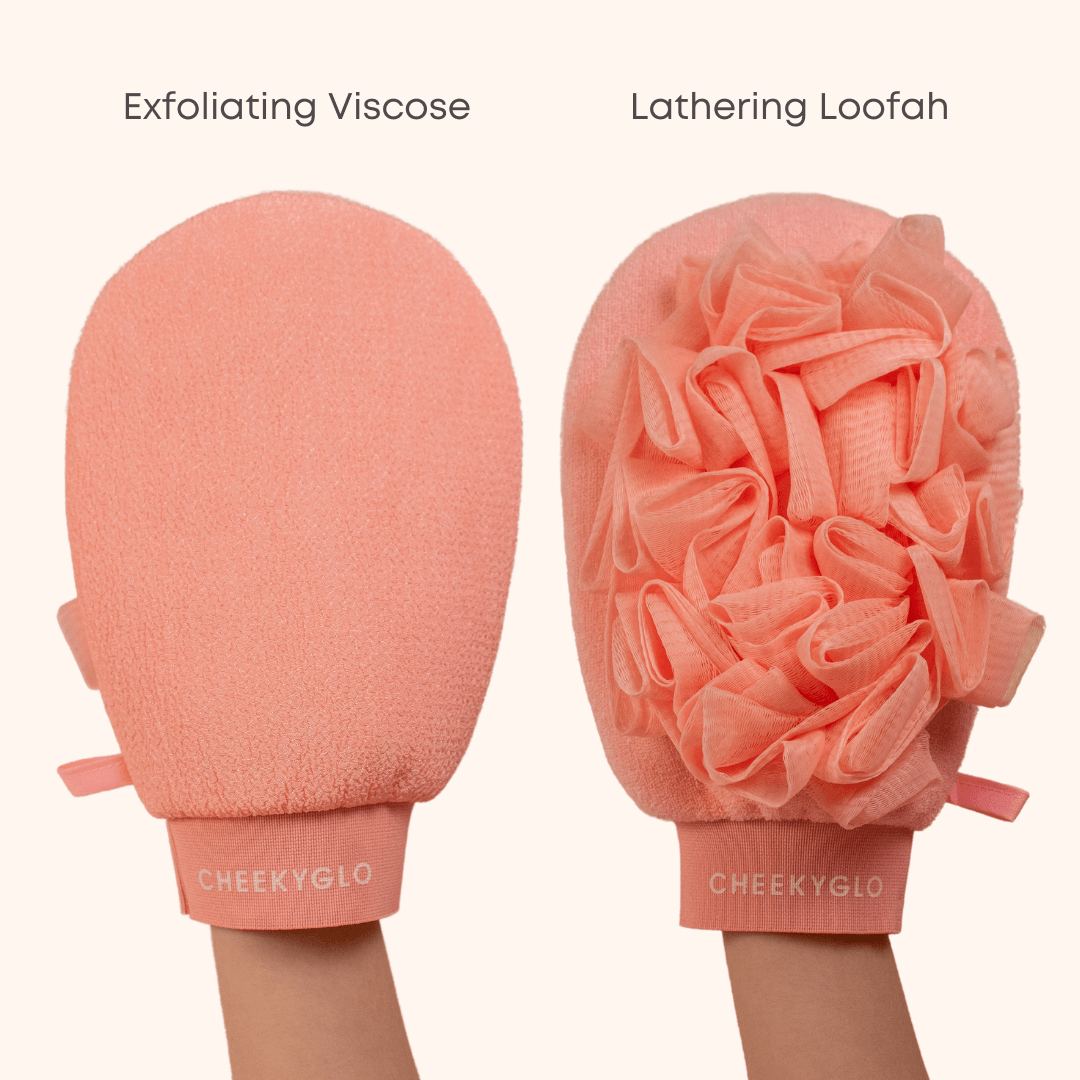An image shows two exfoliating gloves, with one labeled "Exfoliating Viscose" on the left and another labeled "Lathering Loofah" on the right. These peachy-pink gloves from CheekyGlo, known as the CheekyGlo Exfoliating Loofah Glove and held by hands, promise to aid in skin smoothing, making them a must-have for those dealing with keratosis pilaris.