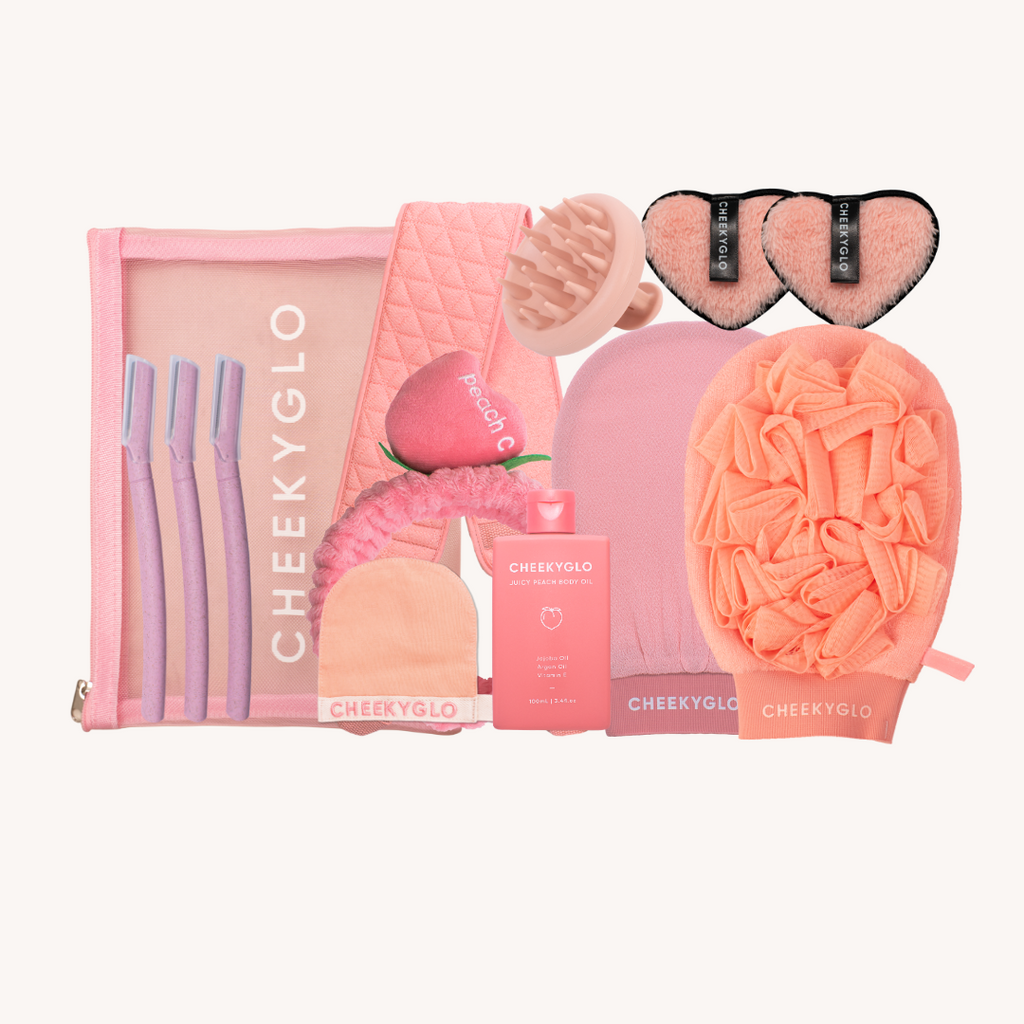 Explore The Everything Set by CheekyGlo, offering pink and peach hues with a mesh pouch, scrunchies, and a scalp massager. Elevate self-care with knitted beanies, heart-shaped pads, and an exfoliating glove—all elegantly displayed on a light background for the best value.