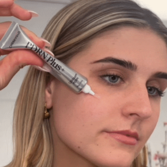 Woman applying the PDRN Plus+ Advanced Collagen Peptide Cream across her face, massaging it in to hydrate, plump, and boost the skin&
