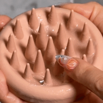 Woman using the CheekyGlo Scalp Scrubber through her hair, massaging and exfoliating the scalp to lift buildup and boost a healthy, clean feel.