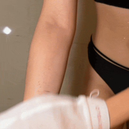 Sensitive CheekyGlo Exfoliating Glove being used to remove dead skin from arms.