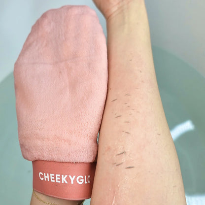 visible dead skin after using the cheekyglo exfoliating glove to remove dead skin