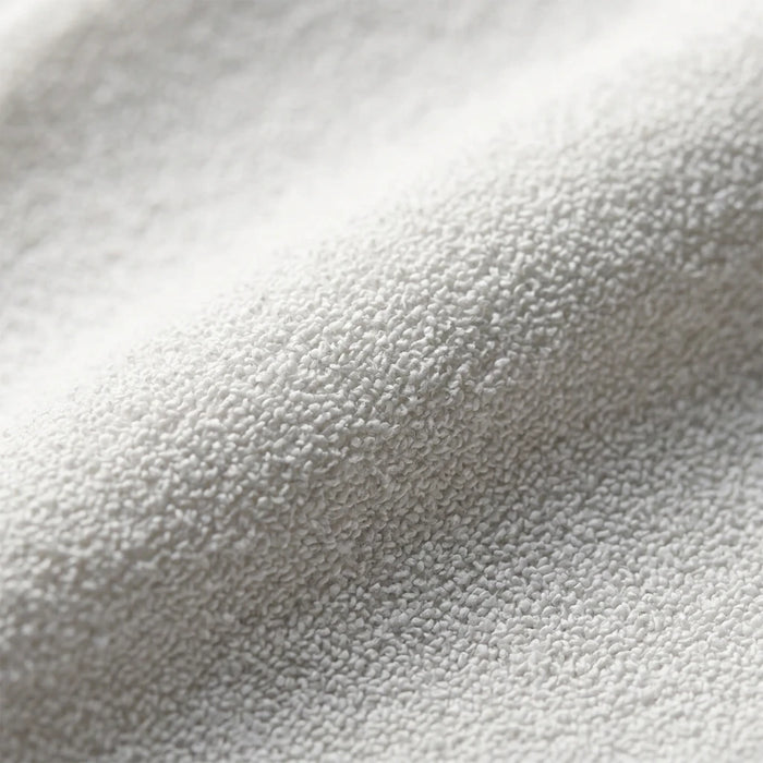 Sensitive white exfoliating glove fabric close-up