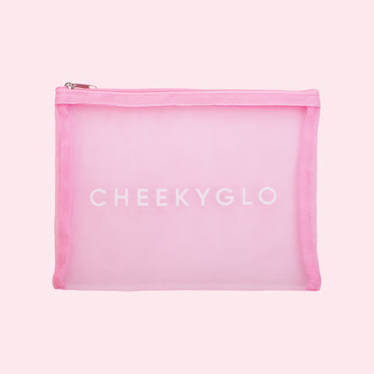 A pink, transparent zippered makeup bag with &quot;CHEEKYGLO&quot; printed in white on the front, perfect for storing your CheekyGlo Ultimate Glow Set and Exfoliating Glove.