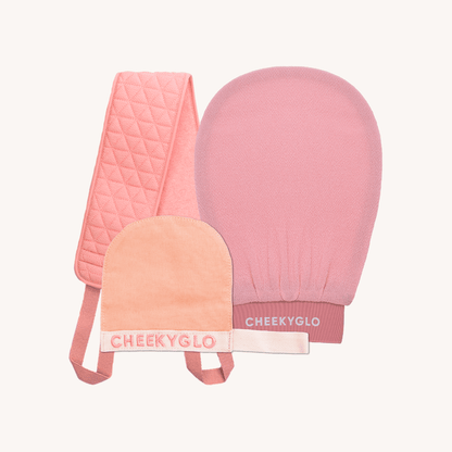 Introducing the Cheekybro Set from CheekyGlo, a collection of pink self-care skincare exfoliating accessories. This set features a textured body scrubber with handles, an exfoliating glove mitt, and a smaller textured face scrubber mitt. Each item is branded with &quot;CHEEKYGLO&quot; in white. Perfect for invigorating your skincare routine!