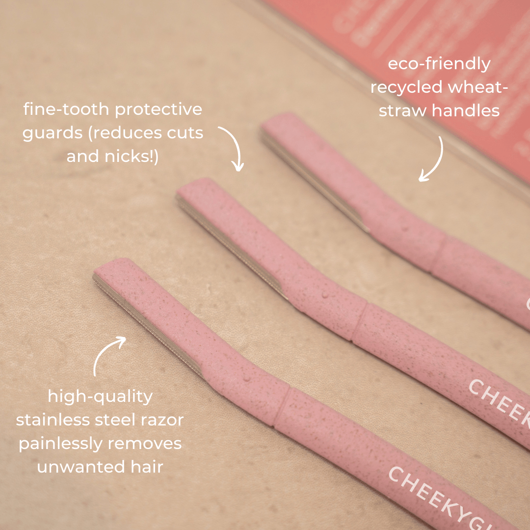 A set of three CheekyGlo Dermablades from CheekyGlo with text annotations stating: &quot;fine-tooth protective guards (reduces cuts and nicks!)&quot;, &quot;eco-friendly recycled wheat-straw handles,&quot; and &quot;high-quality stainless steel Dermablades painlessly remove unwanted hair.&quot; Perfect for facial hair removal!