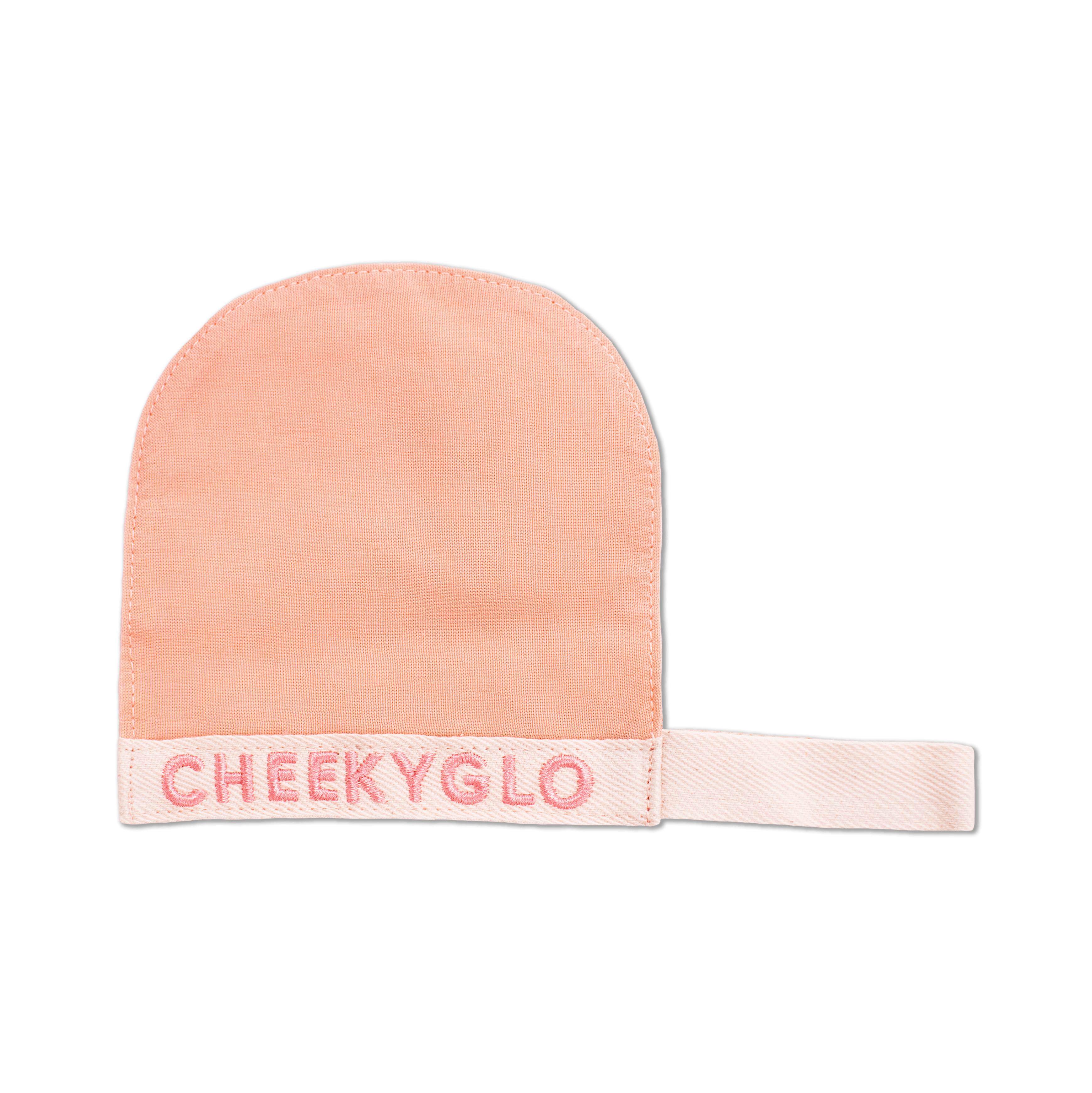 The CheekyGlo Silk Exfoliating Face Mitt, crafted from Premium Turkish Silk in a delicate peach hue, features the word &quot;CHEEKYGLO&quot; embroidered in pink thread on the cuff and is showcased against a black background. This luxurious face mitt from CheekyGlo effectively exfoliates the skin to reveal a radiant glow.