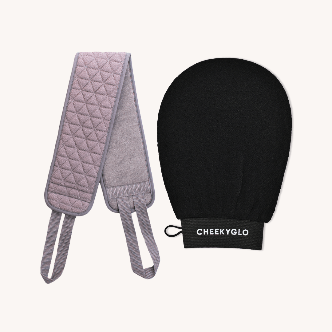 A white backdrop showcases the CheekyGlo Exfoliating Body Duo, featuring a pink quilted back scrubber accented with grey edges and handles, alongside a black body glove crafted from biodegradable viscose.