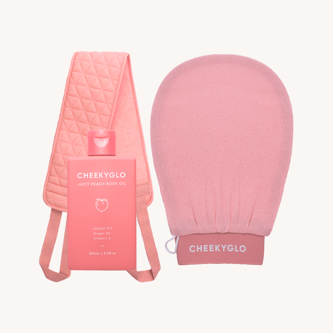 Introducing the Fake Tan Set by CheekyGlo: a luxurious skincare collection featuring a pink exfoliating mitt, a nourishing bottle of peach body oil for moisturizing, and a quilted stretch band. Ideal for maintaining radiant skin whether you&